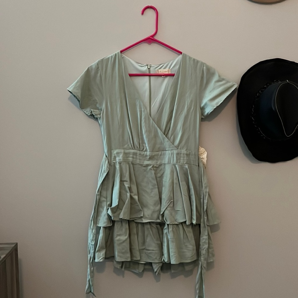 Mint green Romper with double layer shorts appear as skirt and tie back